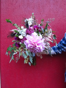 A stunning wedding bouquet with a dinner plate dahlia, gold eucalyptus, ferns, myrtle, waxflower and spray roses | Designed by Natasha Price of alaskaknitnat.com