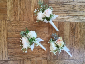 boutonnieres made with white and blush spray roses, seeded eucalyptus and baby's breath | designed by Natasha Price of Alaskaknitnat.com