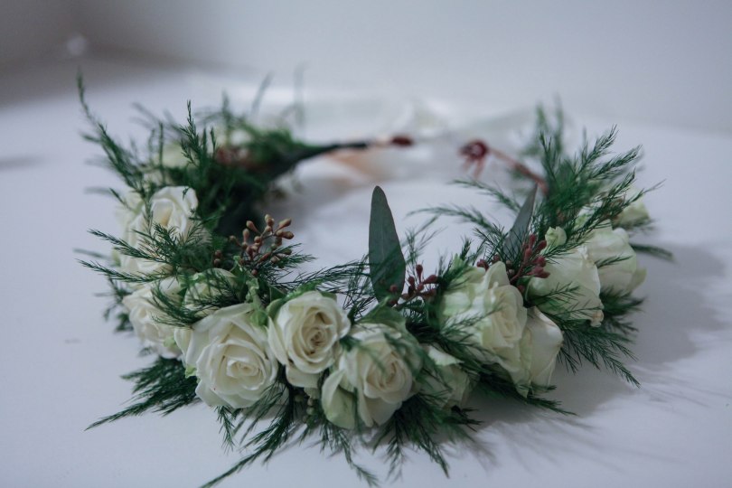 Flower crown made with seeded eucalyptus and white spray roses | designed by Natasha Price of alaskaknitnat.com
