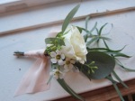 Perfect winter wedding boutonniere made with eucalyptus, spray rose and waxflower | designed by Natasha Price of alaskaknitnat.com